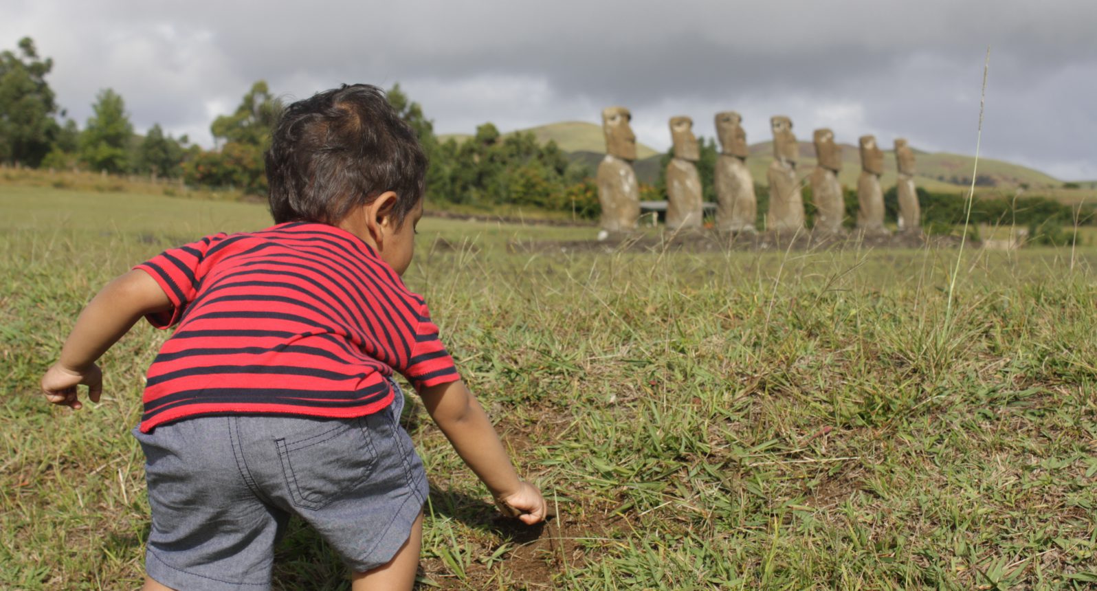 My toddler son digging at Ahu Akivi, Easter Island