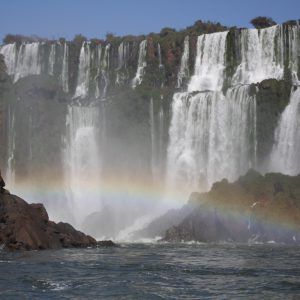 Dazzling rainbows provide a colourful foreground; Iguazu Falls, Argentina