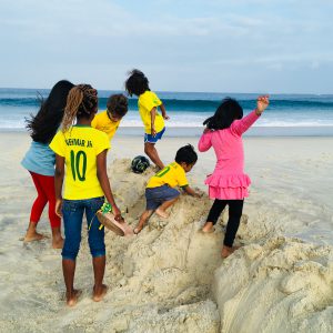 Frolicking in the sand with the favela kids, Rio de Janeiro, Brazil