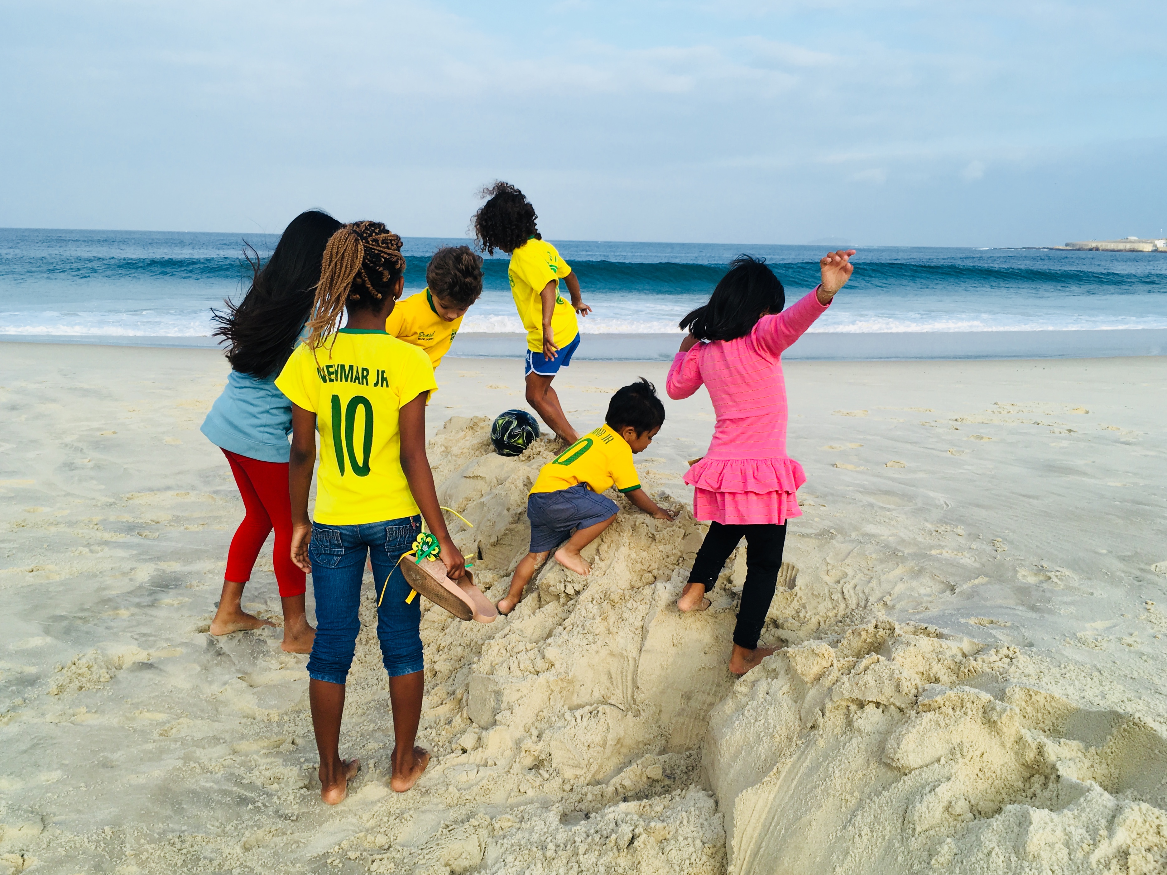 Frolicking in the sand with the favela kids, Rio de Janeiro, Brazil