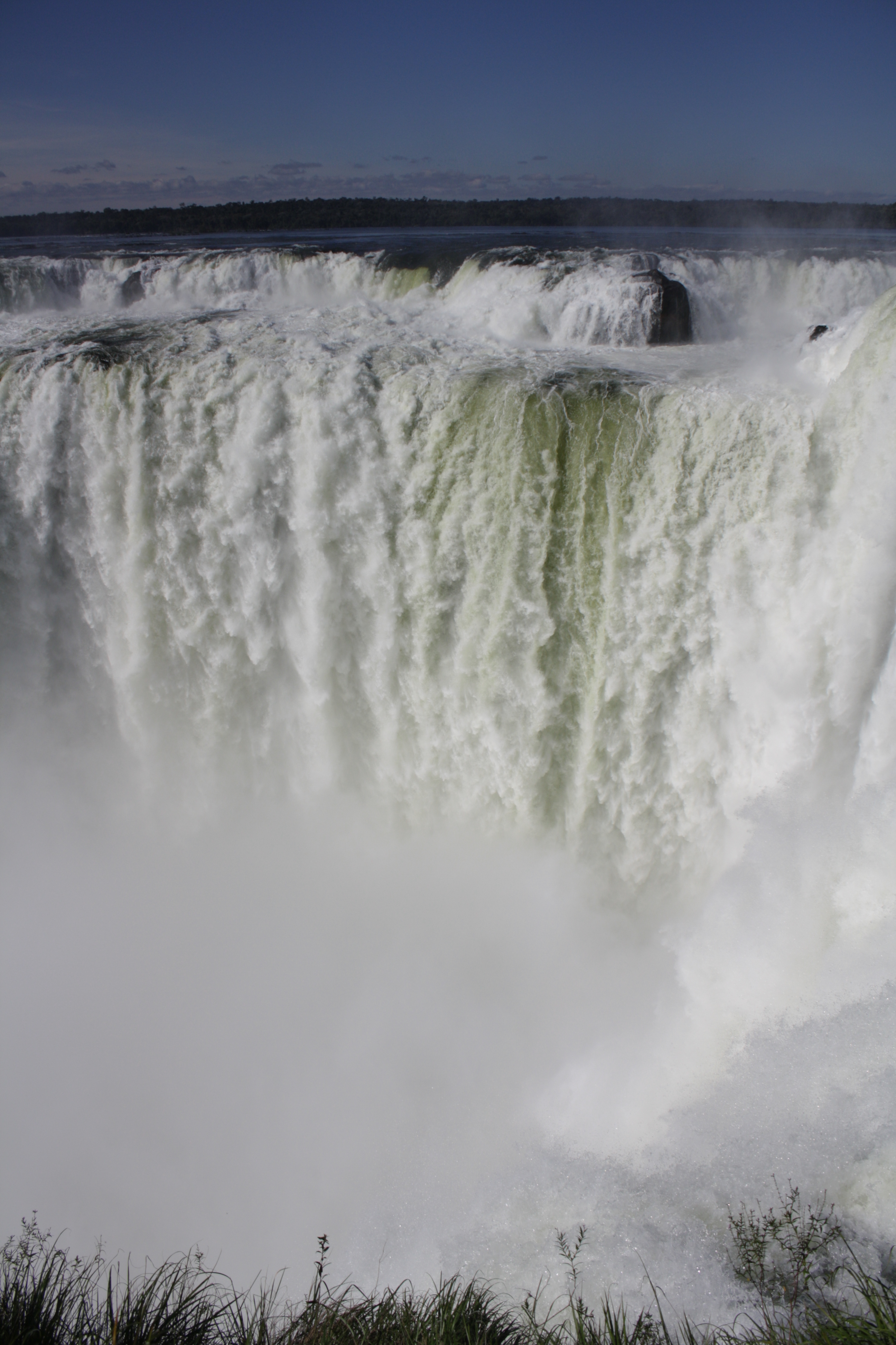 The Devil's Throat is a veritable wall of water cascading down in twisted, frothy jets, Iguazu Falls, Argentina