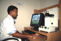 A technician uses a Kertu Analyser for endothelium cell count.